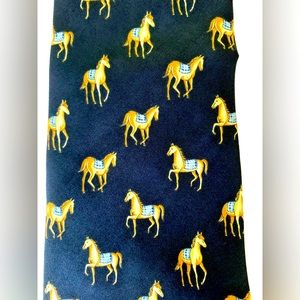 Men’s 100% silk navy blue neck tie with a pattern of gold color horses